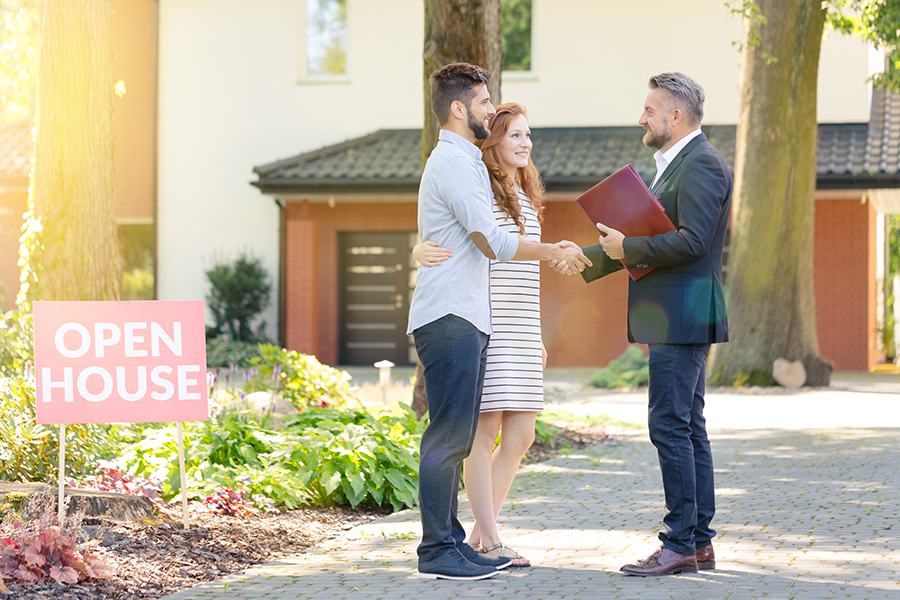 Real estate agent closing a deal on buyers