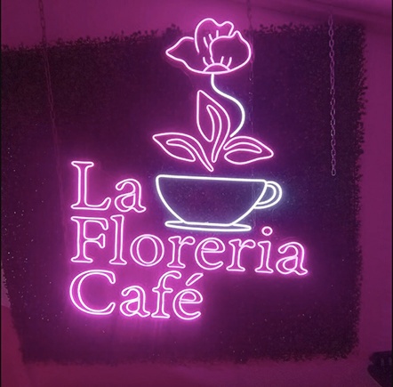 Neon sign advertising a cafe