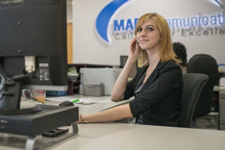 A call center agent at MAP Communications office.