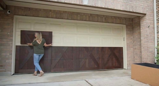 Woman adding faux wood panels to garage