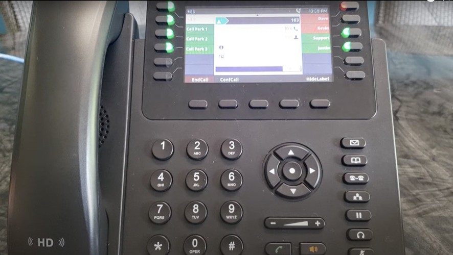 Image of a Grandstream GXP2170 currently making a conference call.