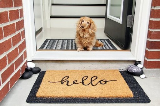 Hello door mat on a front porch