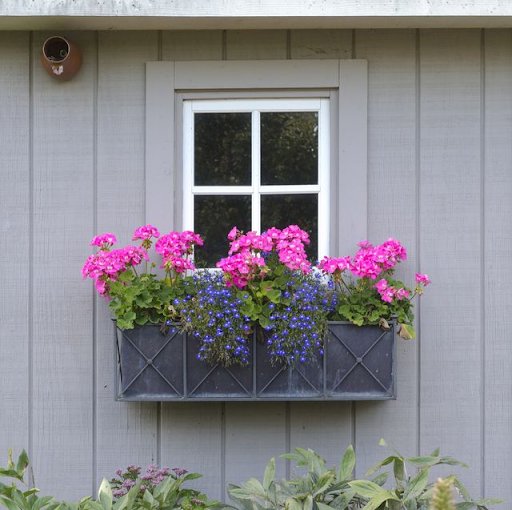 Grey window box with pink and purple flowers