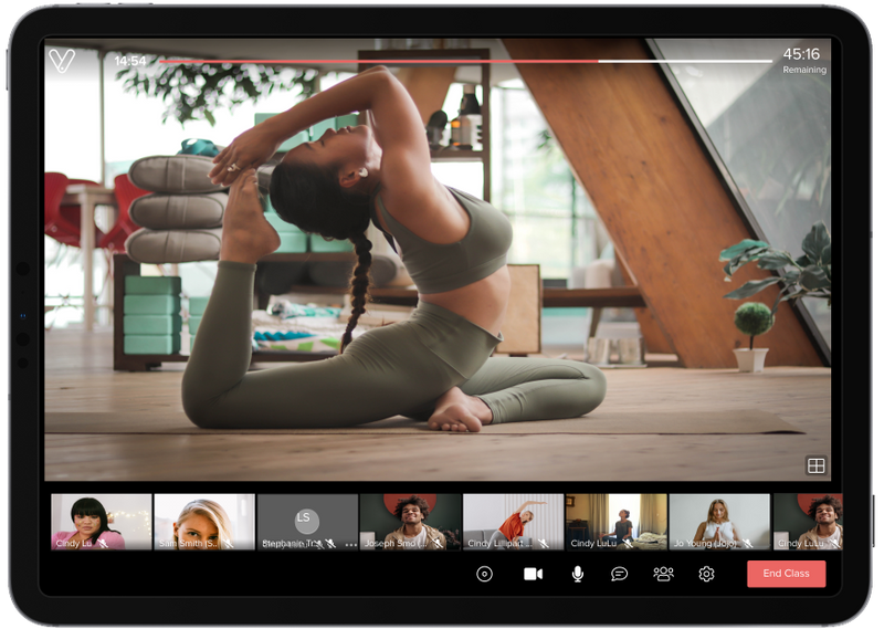 Image showing a class being live-streamed by Vagaro onto a tablet.