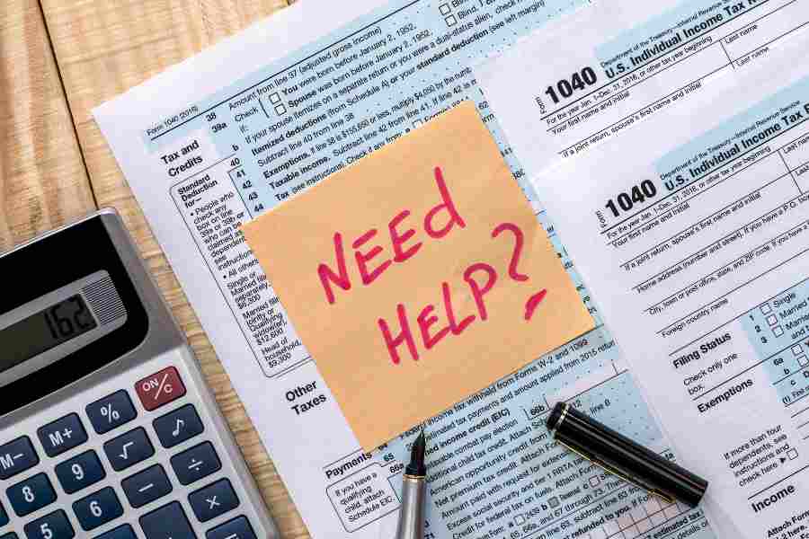 "Need Help" was written in a stickyn note place above the Income Tax Return sheet.