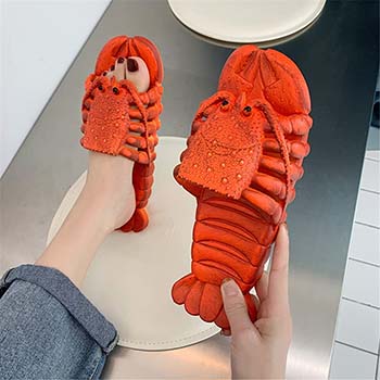 A pair of lobster slipper sandals.