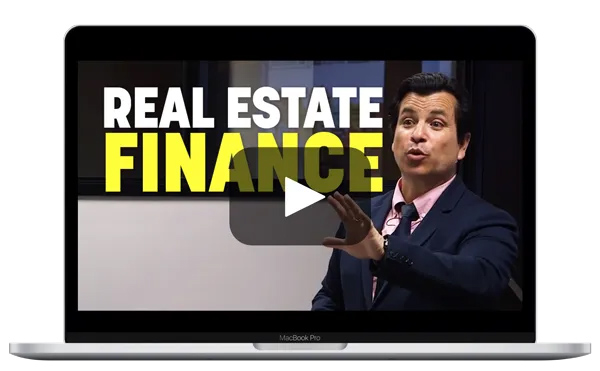 Laptop with man with his arm forward teaching an online real estate finance course.