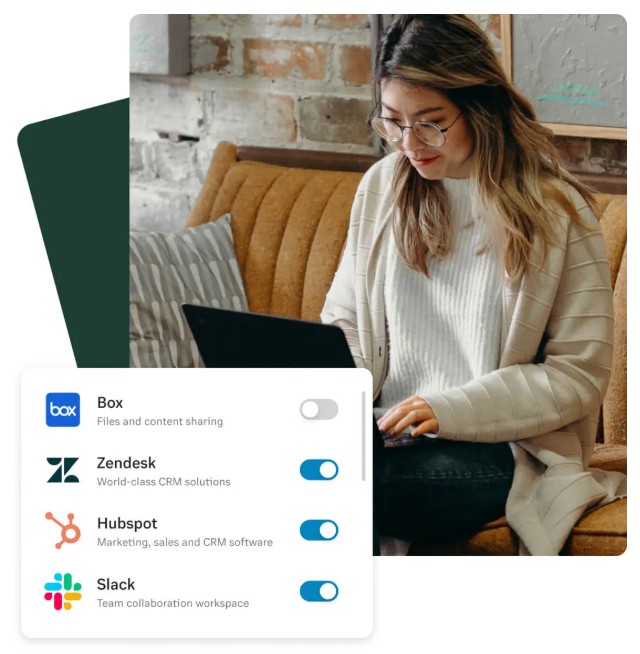 Woman on a laptop with a pop-up featuring RingCentral integrations, like Slack and Zendesk.