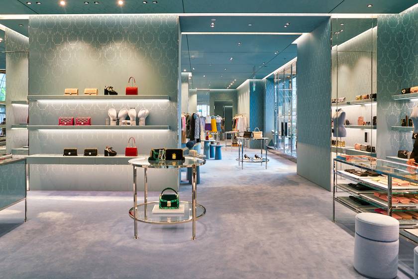 Blue walls and carpet in a high-end retail store.