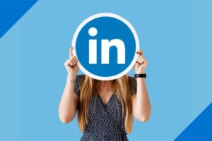 woman holding LinkedIn logo