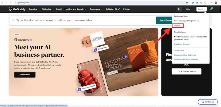 The GoDaddy homepage with an arrow pointing to a sign-in menu in the top-right corner