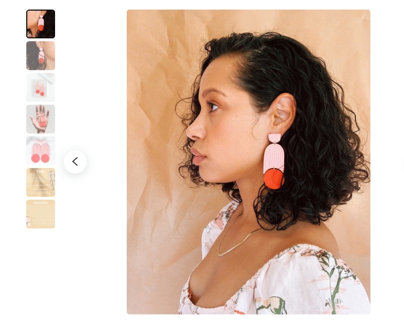 A product photo gallery with seven thumbnails and one main image of the profile of a person wearing large, colorful earrings.