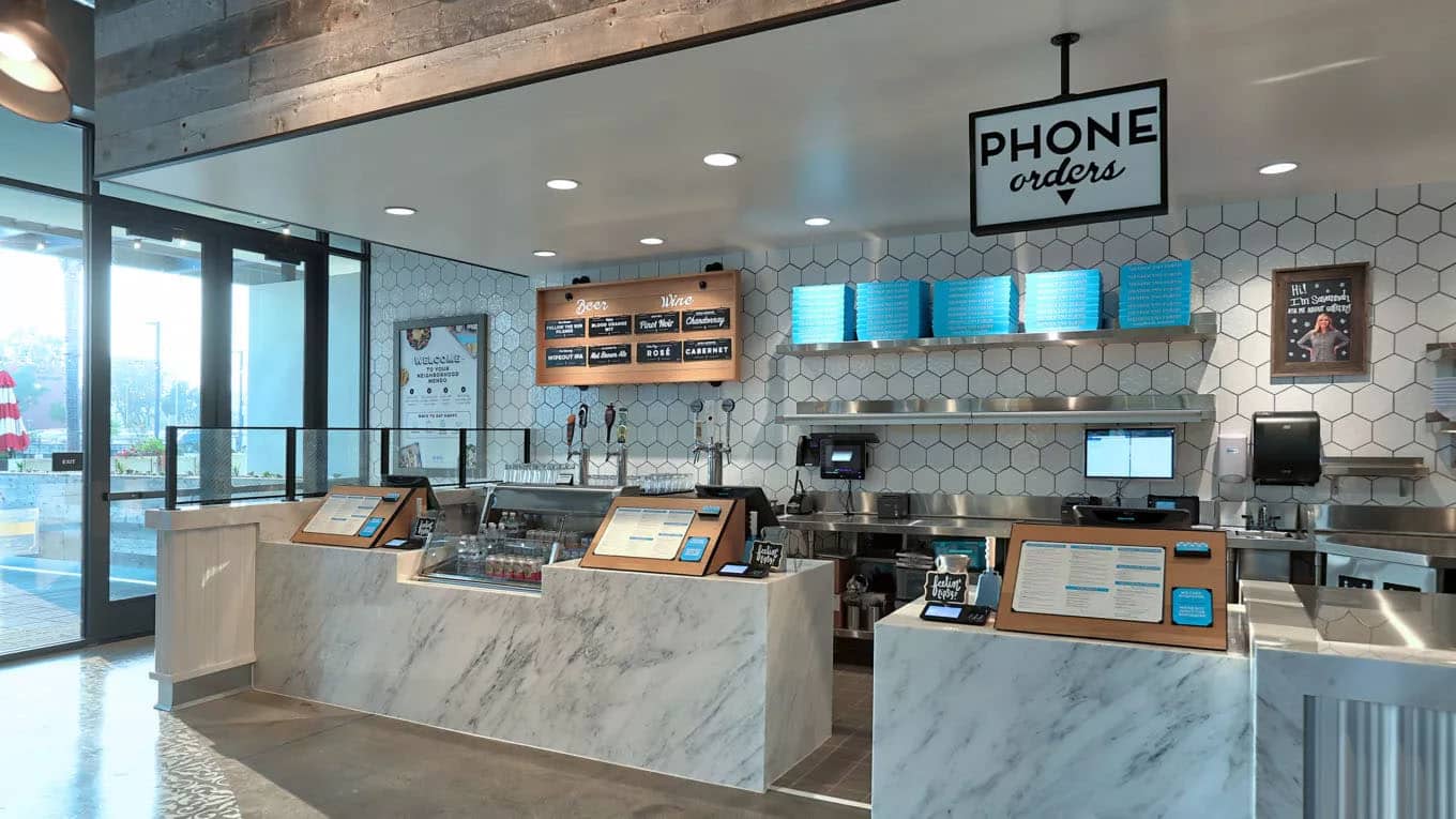 Order counter at Mendocino Farms with areas for placing new orders and picking up phone orders.