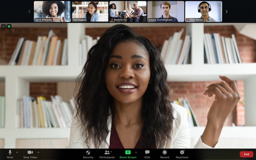 Zoom's meeting interface with a personal spotlighted and the rest of the participants in gallery view at the top part of the screen.