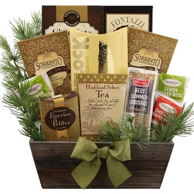 A gift basket with snacks and foliage arranged in a wooden container.