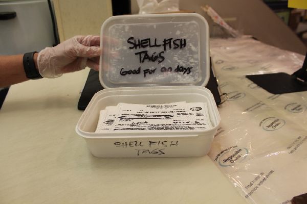 box of tags regarding shellfish.