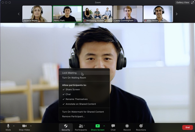A live Zoom meeting with the cursor hovering above the lock meeting option