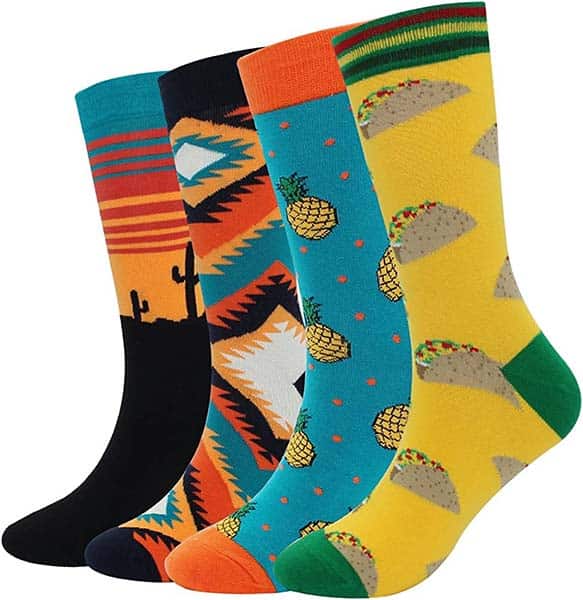 Four different colorful dress socks for men on white background.