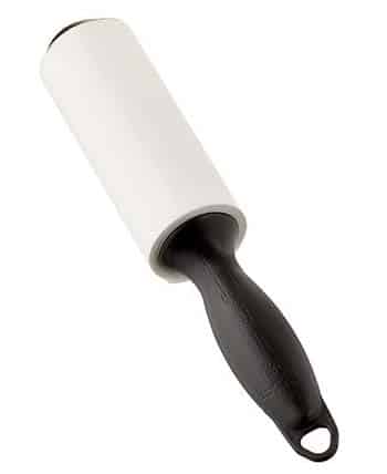 Lint roller with black handle on white background.