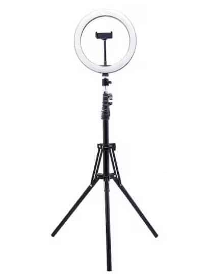 Ring light on stand facing camera. 