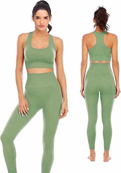 Woman with dark hair wearing a green legging and sports bra set.