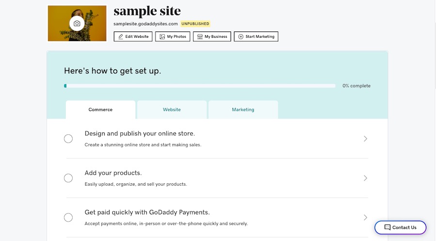 GoDaddy's main dashboard with tabs for commerce, website, and marketing