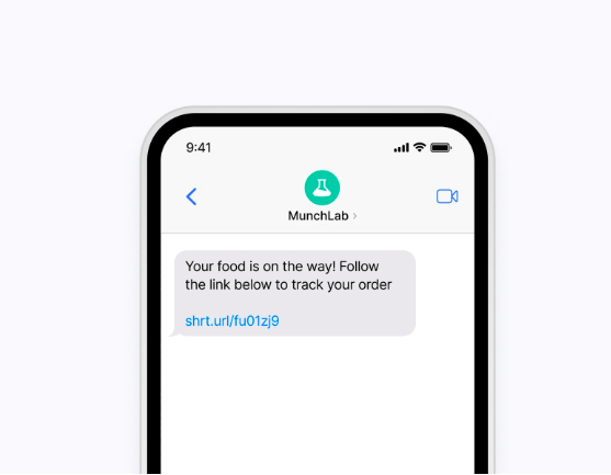 A mobile screen showing a text message from “MunchLab” informing that the food delivery is on the way.