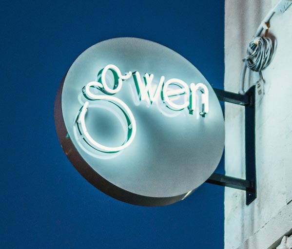 Neon sign outside Gwen restaurant.