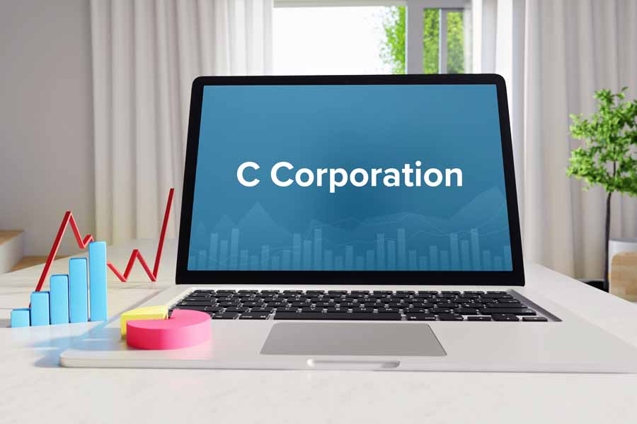 Business laptop in the office with C Corporation term on the screen.