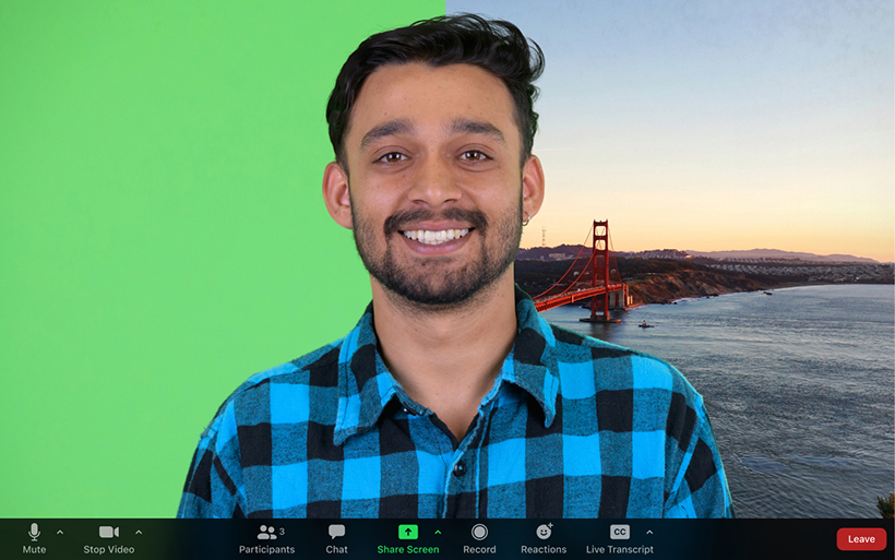 Zoom meeting participant with their background split in half, one is a green screen and the other a scenic background.