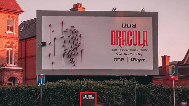 BBC's billboard for its TV show "Dracula" showing a collection of bloody stakes during daytime.