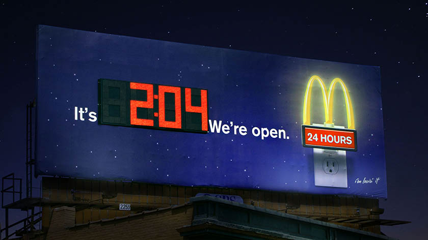 Mcdonald's 24 hours open billboard with built-in live clock