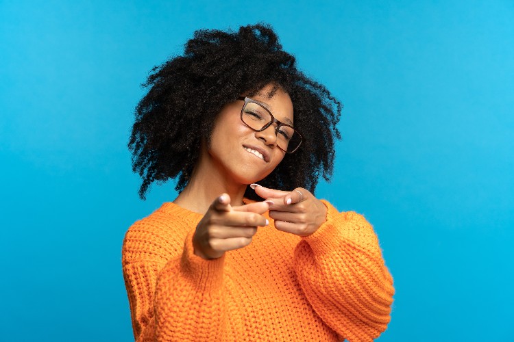 Woman smiling and pointing