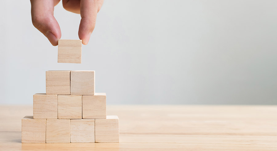 Hand stacking wooden blocks