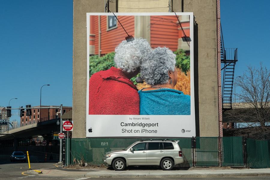 Apple's "Shot on iPhone" billboard campaign featuring a photo of two elderly women taken by an iPhone user.