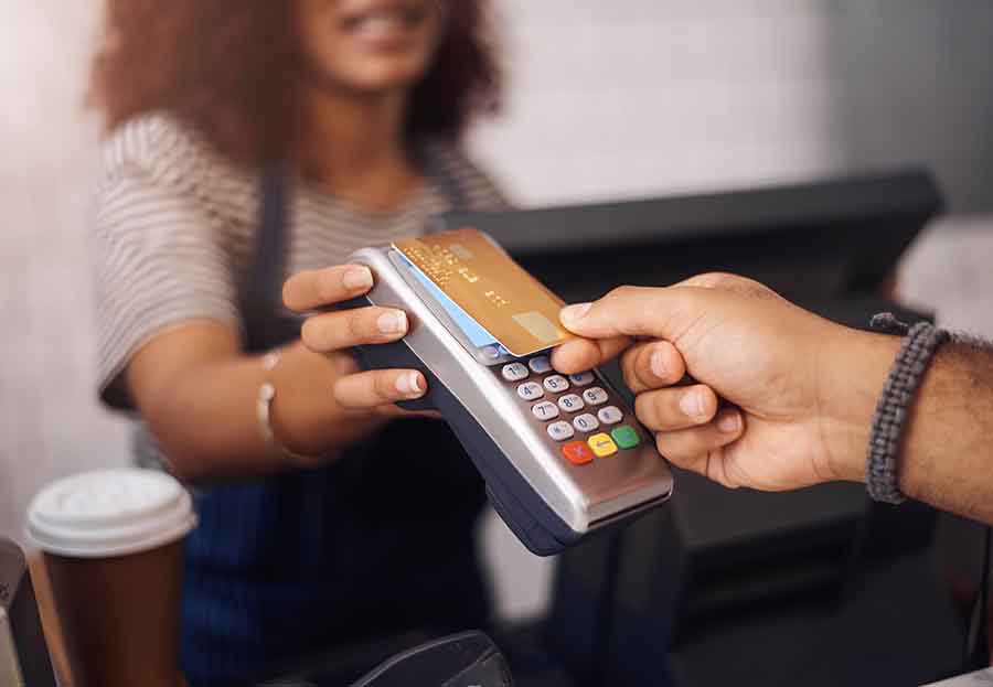 A customer using credit card to pay.