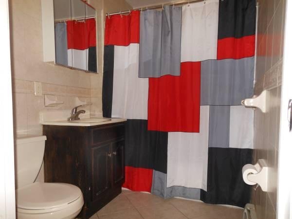 Dark photo of a bathroom real estate listing.