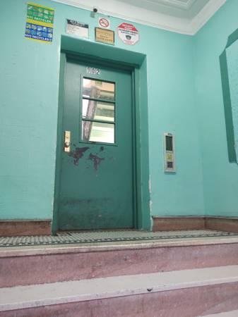 Poor photo of an apartment door.