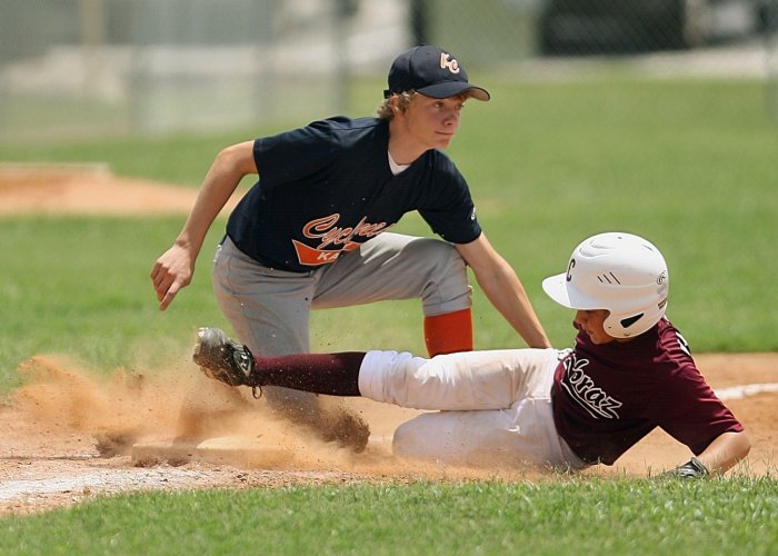 Two youth playing baseball.