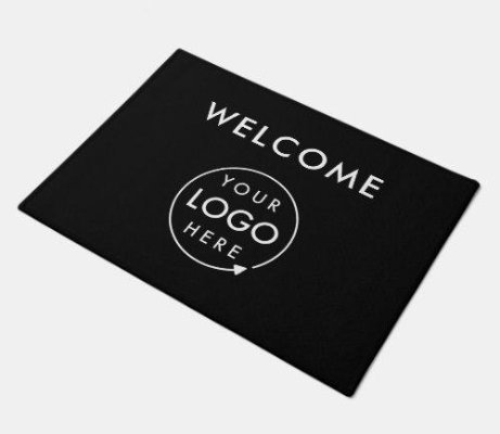 A customizable black doormat with a blank space in the center to accommodate a personalized logo or design.
