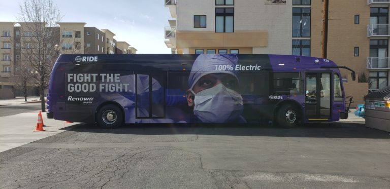 A photo of a healthcare ad on a city bus.