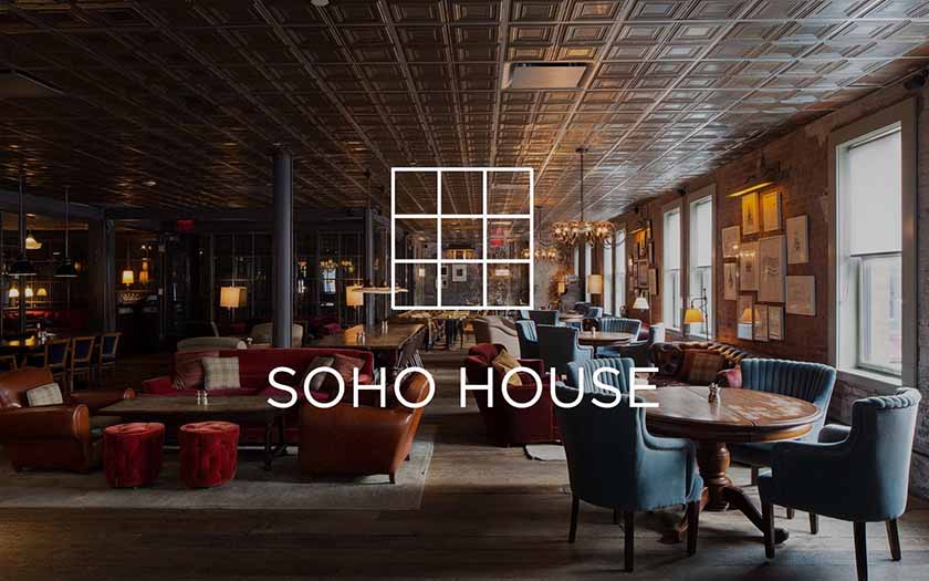 Soho House add with logo in the middle and image of a fancy lounge in the background. 