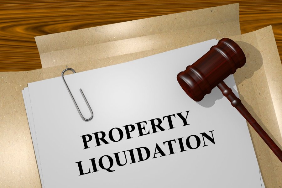 Property liquidation documents and a gavel.