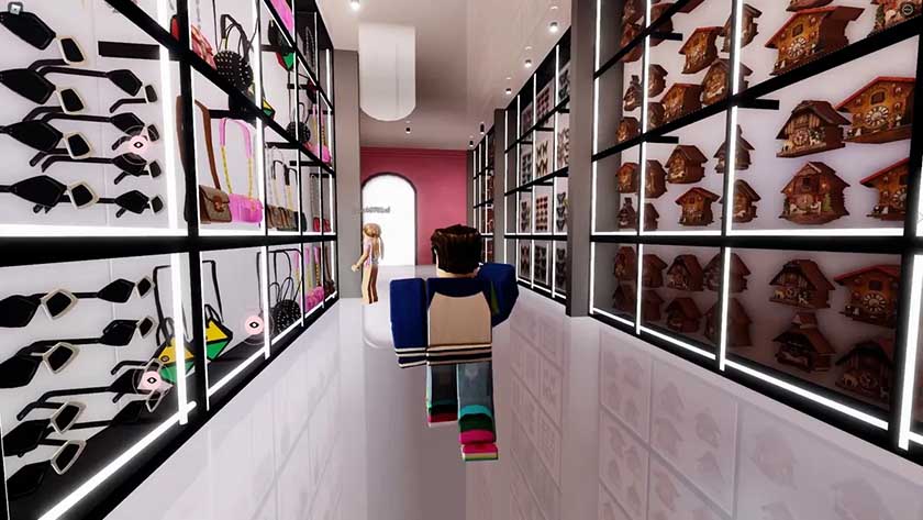 A Roblox avatar walking through a virtual aisle of sunglasses, handbags, and wall decor.