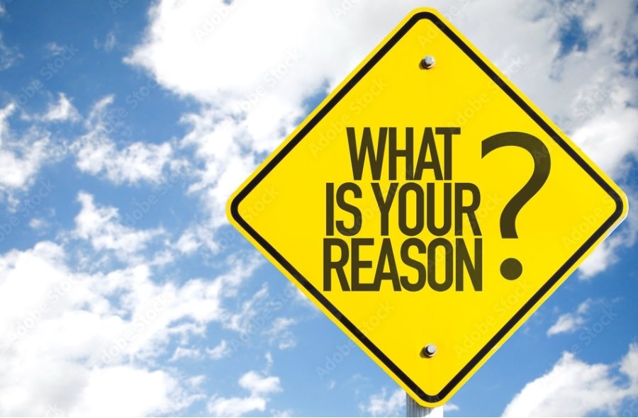 A yellow street sign that says, "What's Your Reason?"