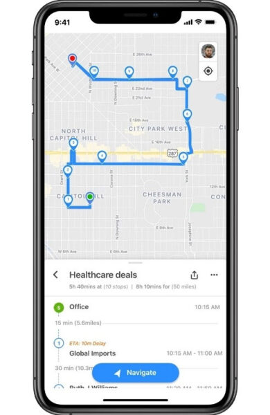 A cellphone screen displaying Zoho CRM mobile app's RouteIQ for intelligent route planning.