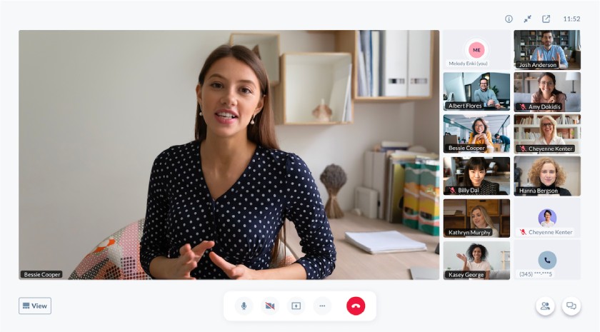 A woman hosting a video meeting with team members using the Nextiva app.