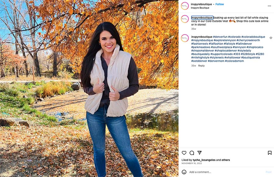 Instagram post from Inspyre Boutique with woman under fall trees in a fuzzy vest.