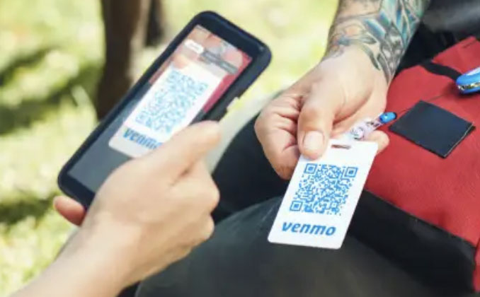 Printed Venmo QR code scanned with a smartphone camera.