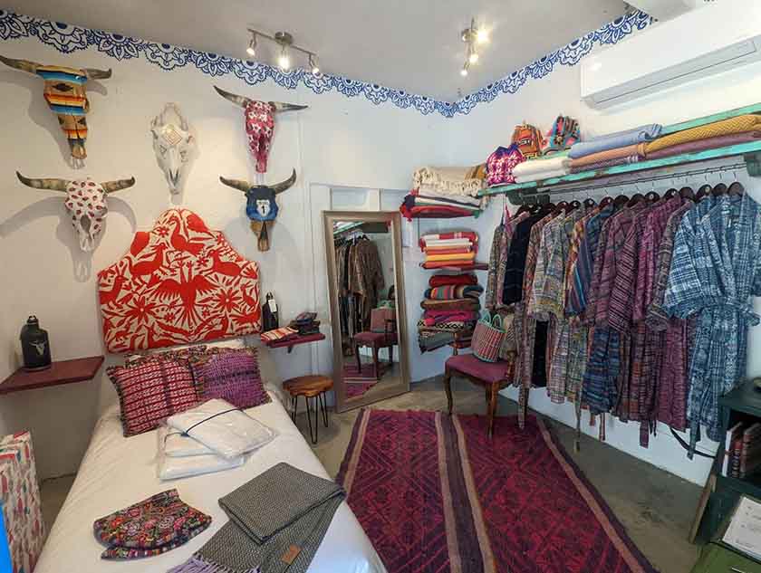 A boho boutique with an assortment of cross-merchandised lifestyle displays.